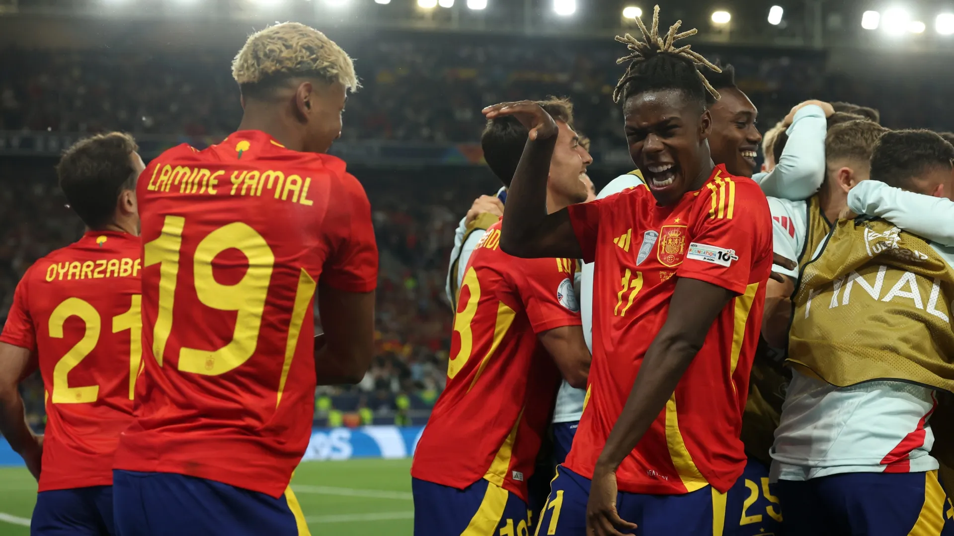 Lamine Yamal of Spain celebrates scoring with Nico Williams.