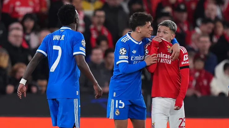 Gianluca Prestianni of Benfica speaks towards Vinicius Junior of Real Madrid.