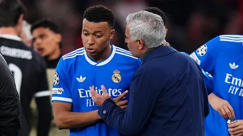 Kylian Mbappe of Real Madrid speaks to Jose Mourinho, Head Coach of Benfica.