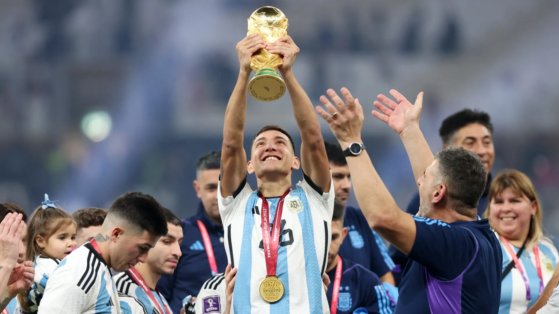 Nahuel Molina of Argentina lifts the World Cup.