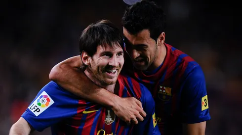 Lionel Messi of FC Barcelona (L) celebrates with his teammate Sergio Busquets of FC Barcelona