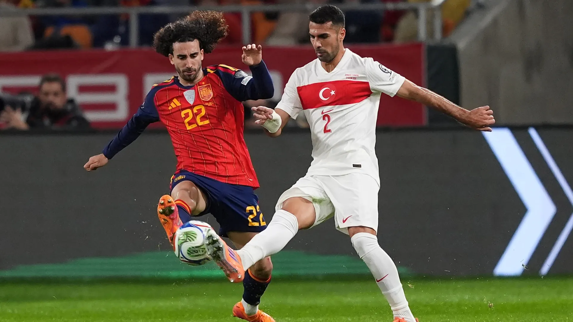 Marc Cucurella of Spain battles for possession with Mehmet Zeki Celik of Türkiye.