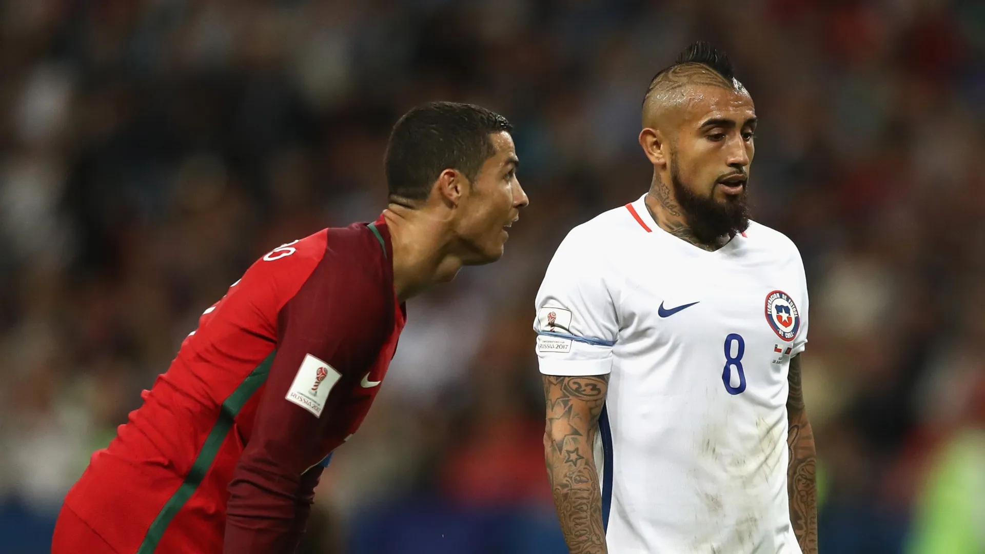 Cristiano Ronaldo of Portugal and Arturo Vidal of Chile.