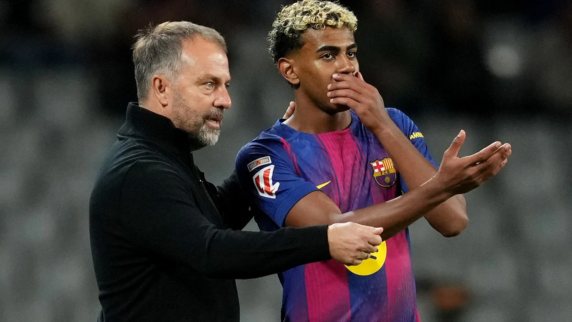 Hansi Flick and Lamine Yamal of Barcelona