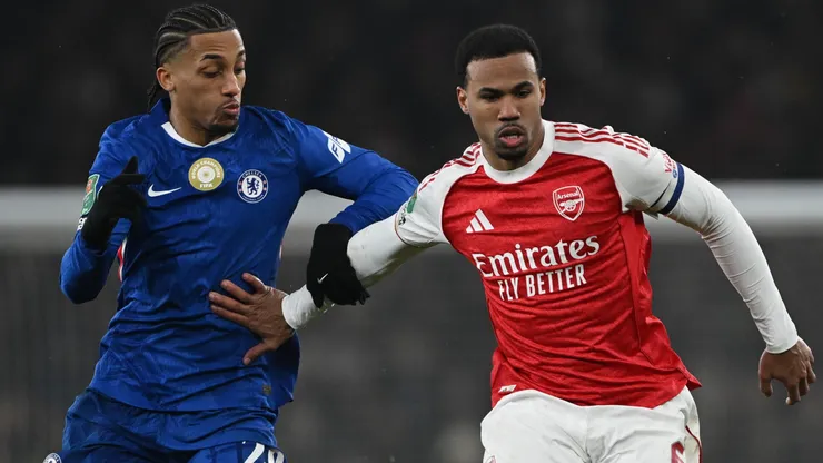 Gabriel Magalhaes of Arsenal is challenged by Joao Pedro of Chelsea.
