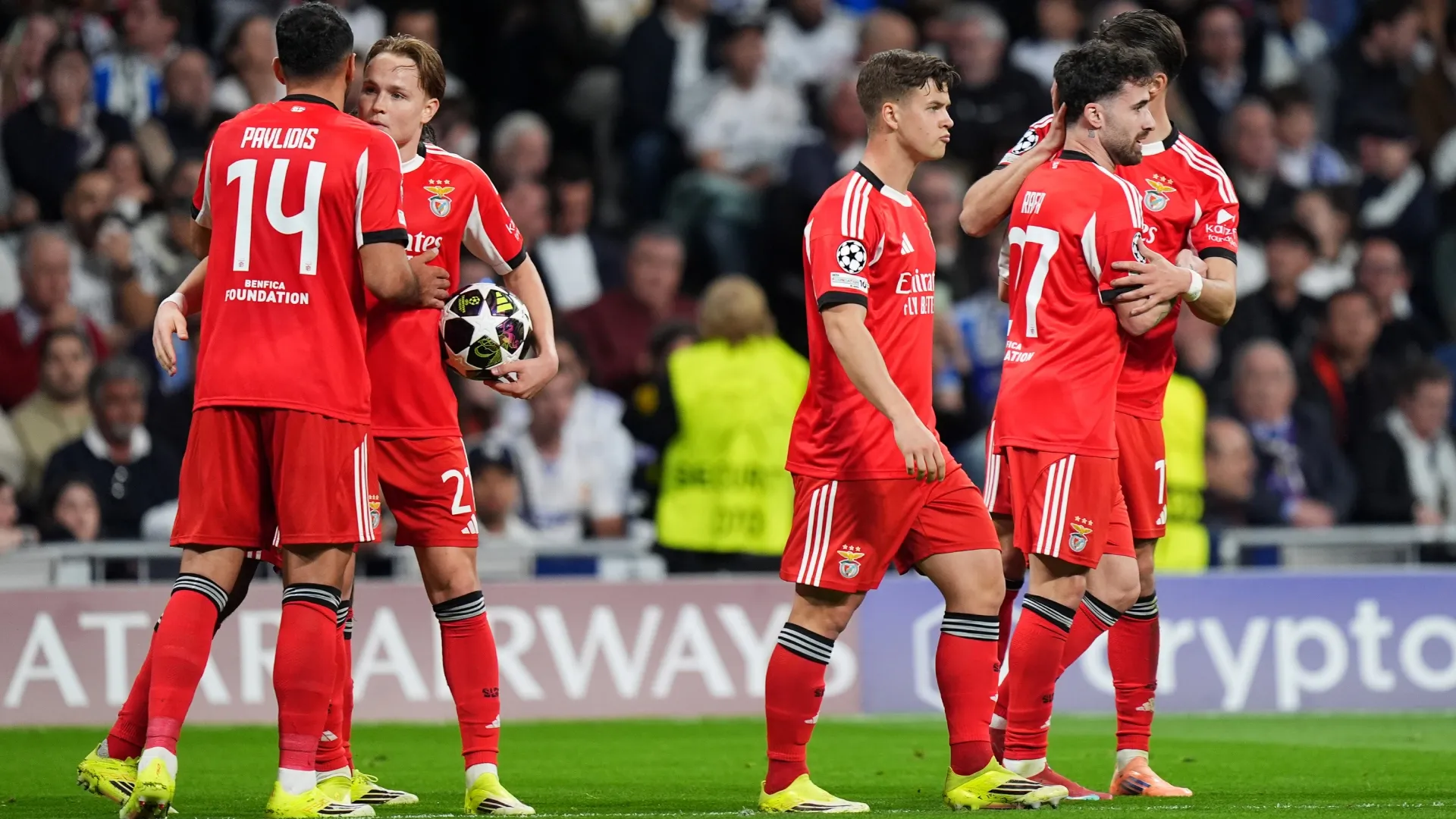 SL Benfica players celebrating a goal vs, Real Madrid in the UEFA Champions League.