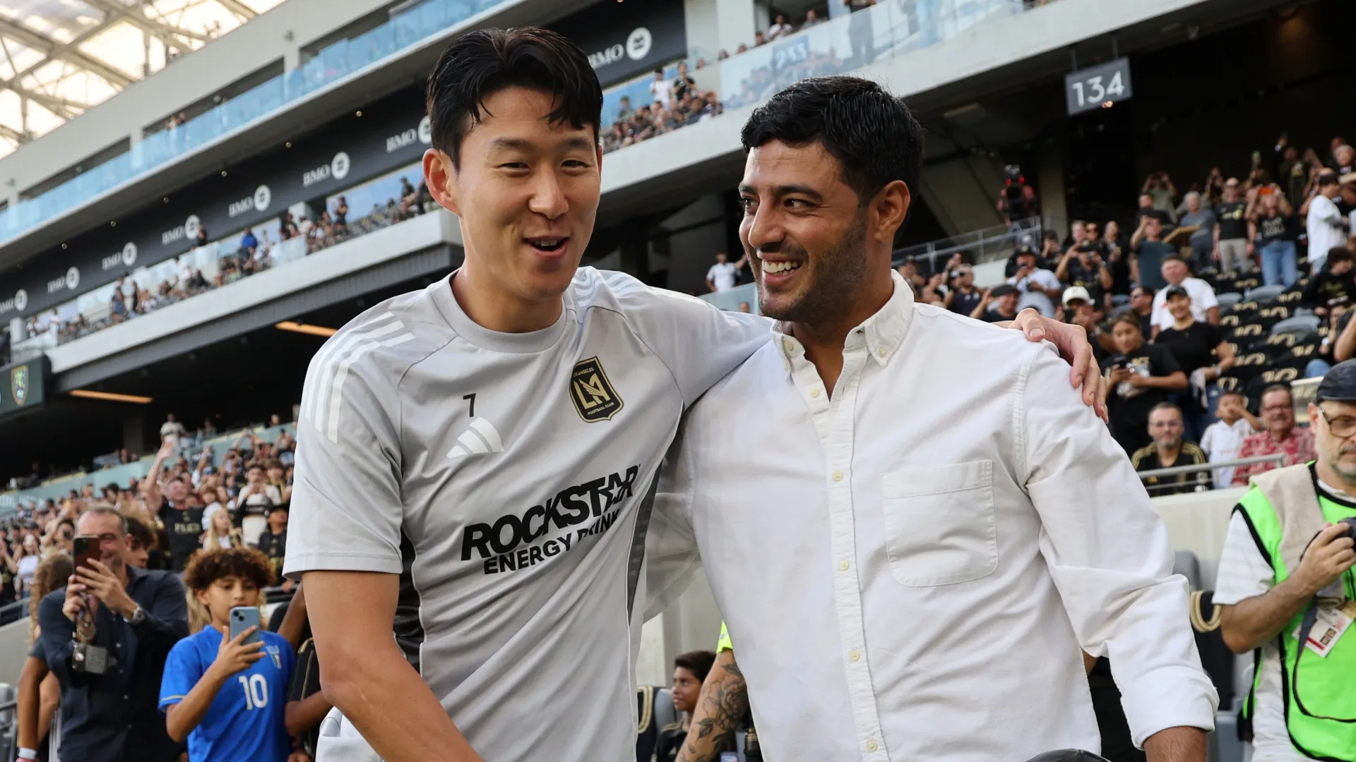 Son Heung-Min #7 of Los Angeles FC greets former Los Angeles FC player Carlos Vela.