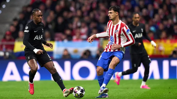 Marc Pubill of Atletico de Madrid is challenged by Mathys Tel of Tottenham
