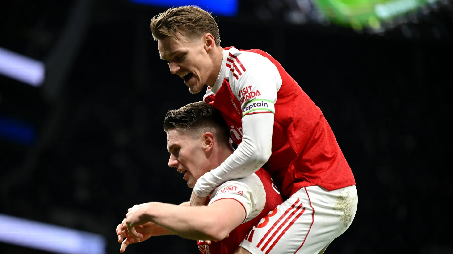 Viktor Gyoekeres of Arsenal celebrates with teammate Martin Odegaard after scoring against Tottenham Hotspur.