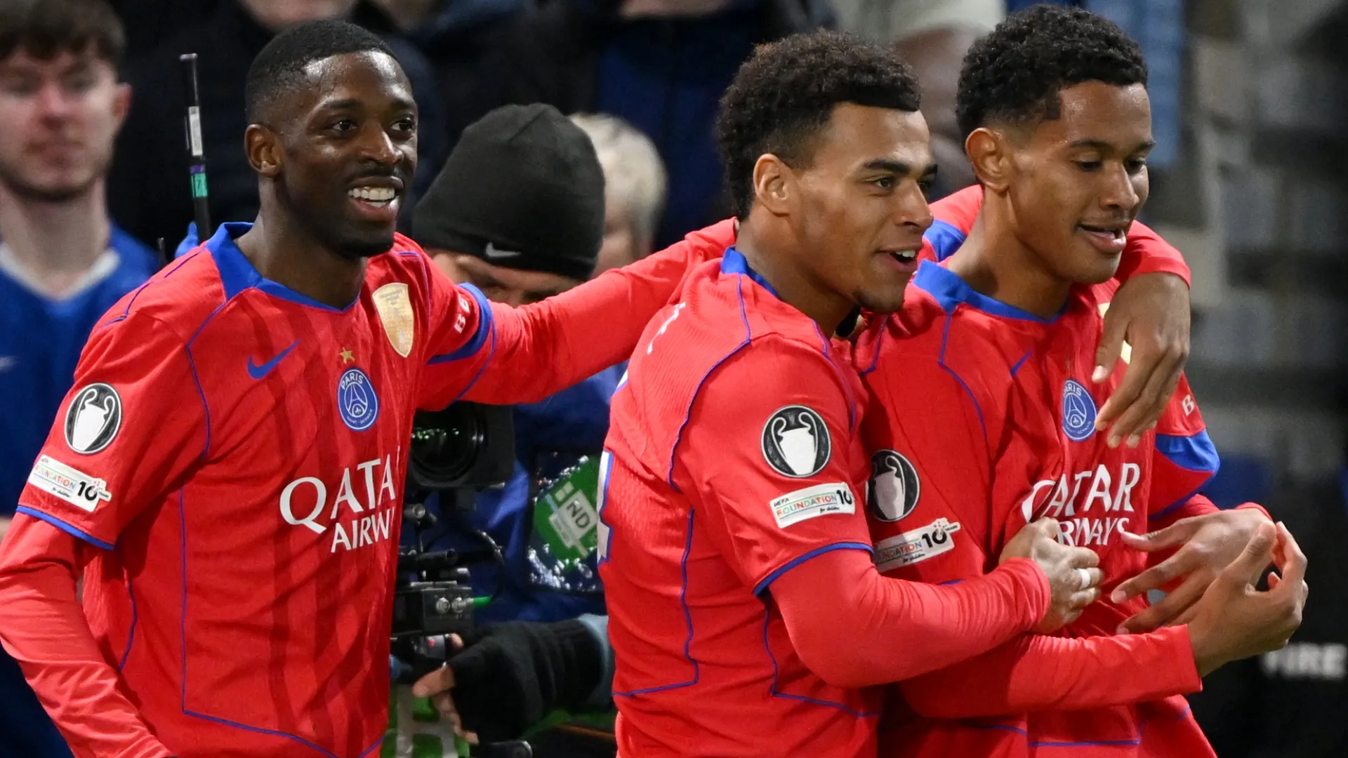 Senny Mayulu of Paris Saint-Germain celebrates scoring a goal with Ousmane Dembele and Desire Doue.