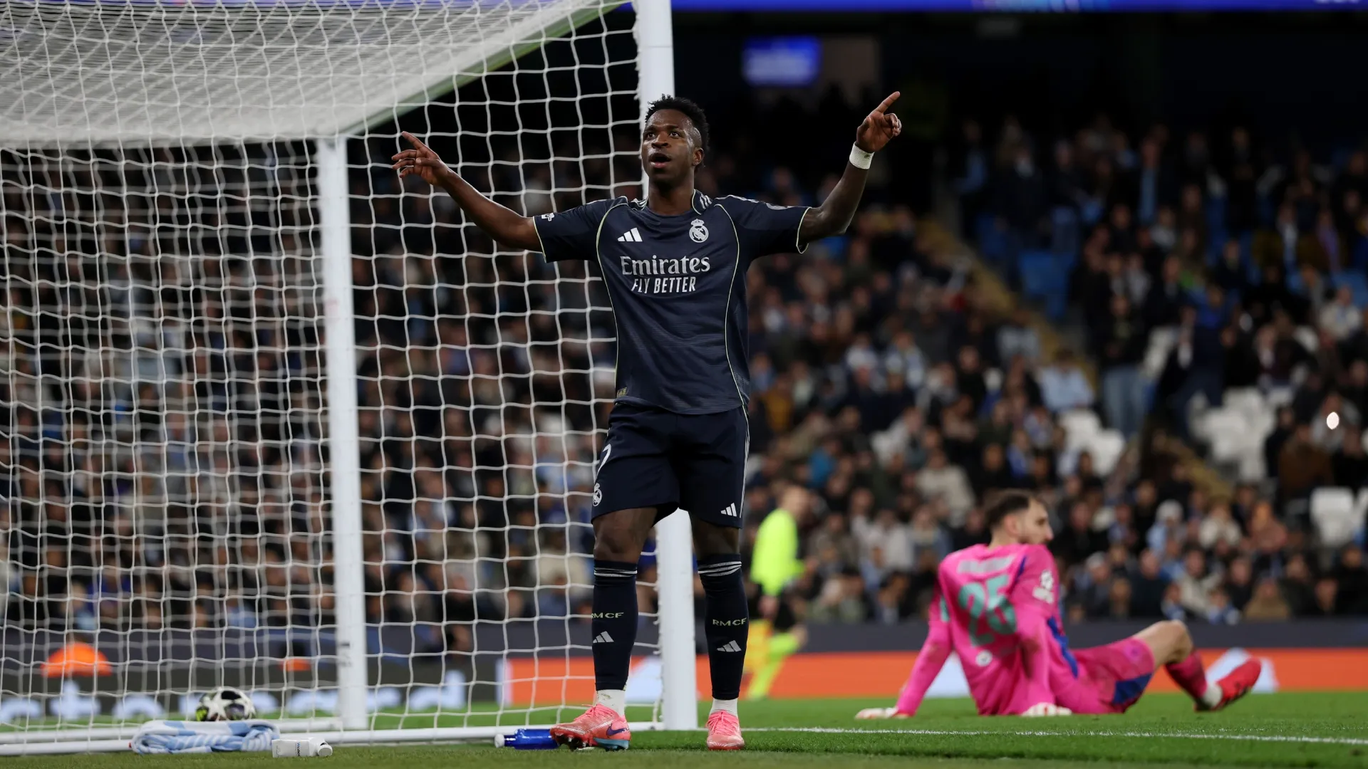 Vinicius Junior of Real Madrid celebrates scoring against Manchester City.
