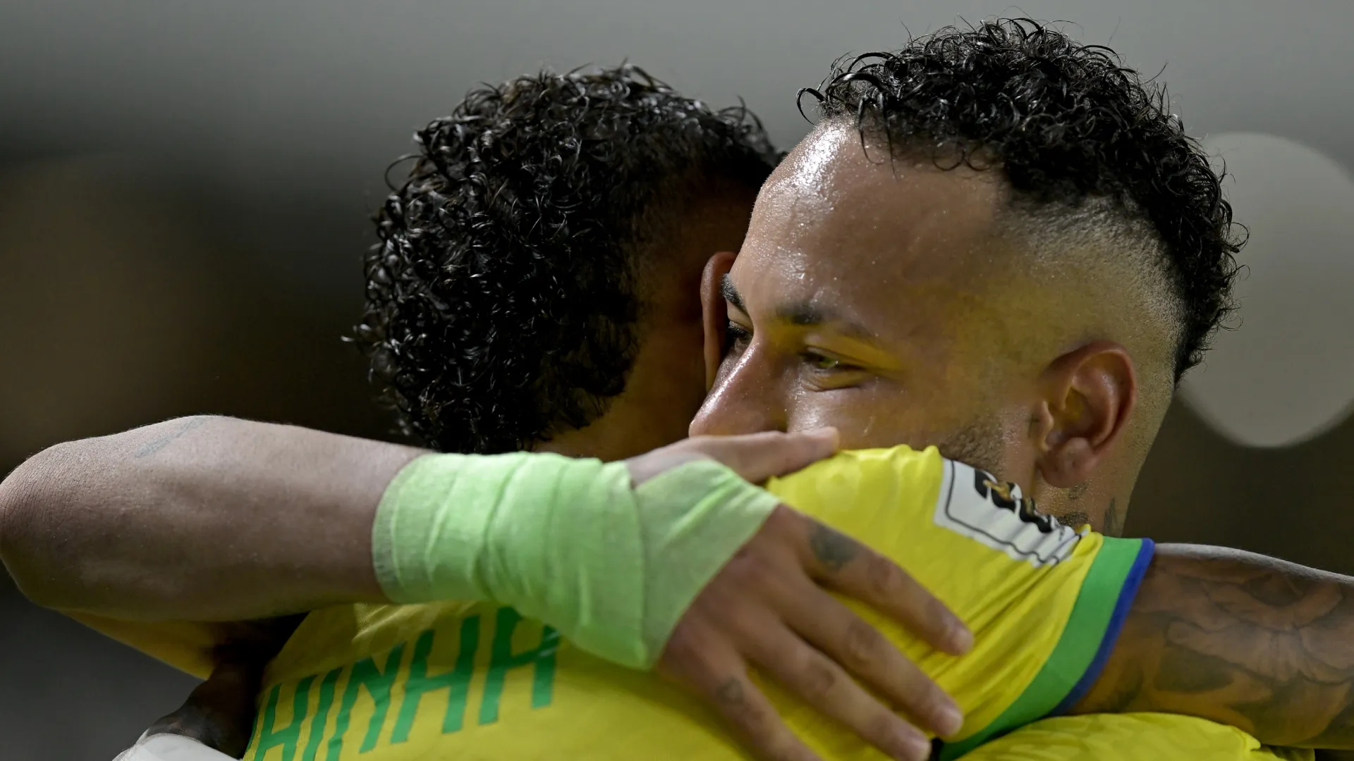Raphinha celebrates with Neymar Jr. of Brazil.
