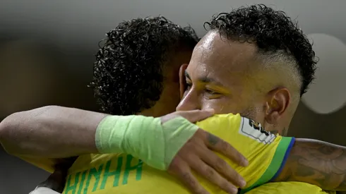 Raphinha celebrates with Neymar Jr. of Brazil.