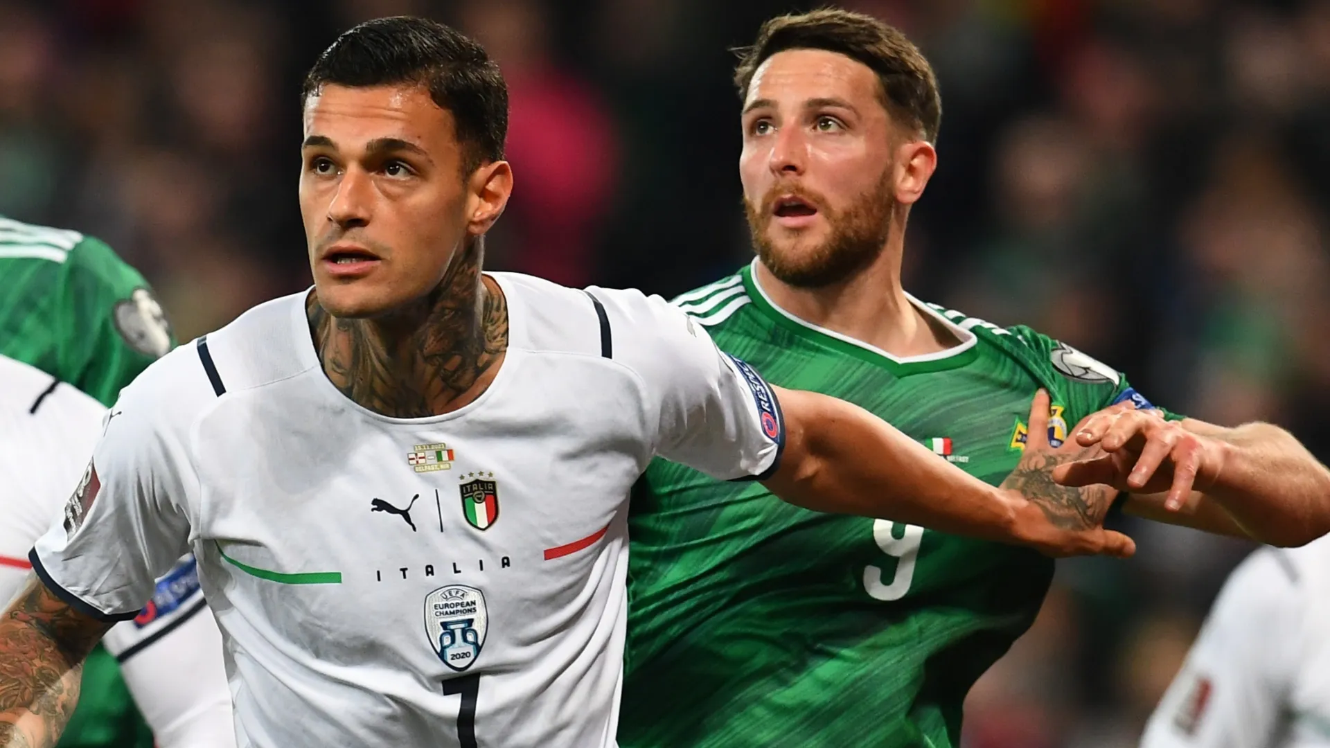 Gianluca Scamacca of Italy competes for the ball with Conor Washington of Northem Ireland in 2021.