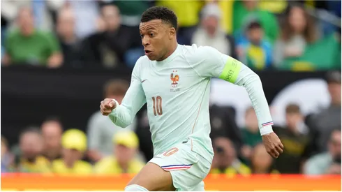 Kylian Mbappe of France runs with the ball during the international friendly match against Brazil.