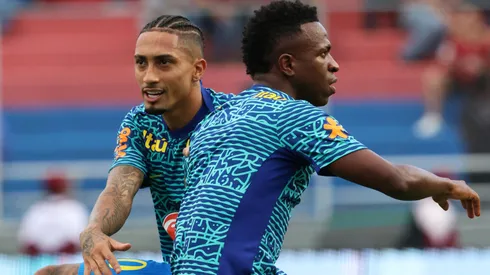 Raphinha and Vinicius Junior of Brazil warm up