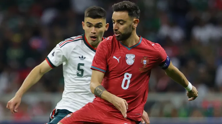 Bruno Fernandes of Portugal is challenged by Johan Vásquez of Mexico.