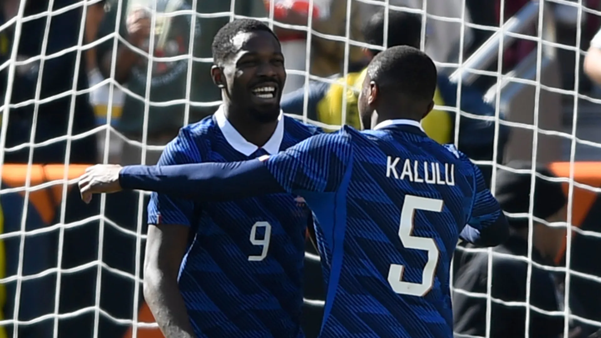 France stars Marcus Thuram and Pierre Kalulu celebrating a goal vs. Colombia
