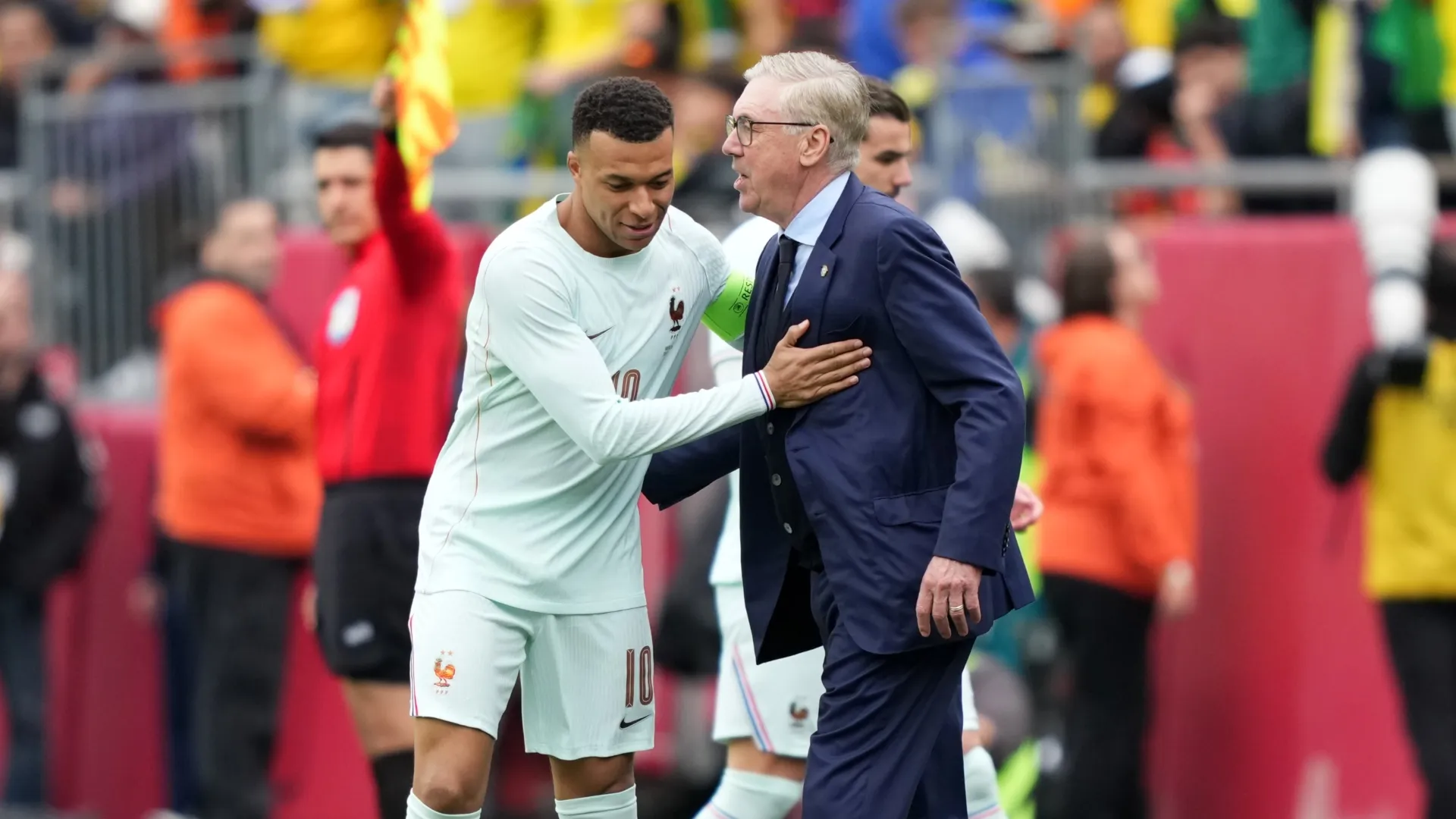 Kylian Mbappe of France greets Carlo Ancelotti, Head Coach of Brazil.