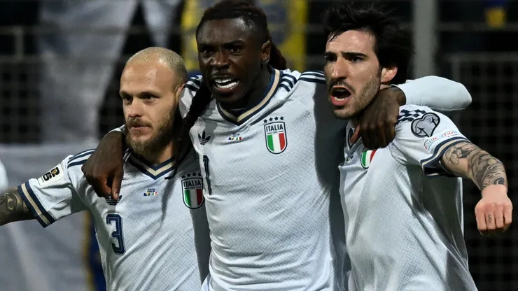 Moise Kean of Italy celebrates with his teammates after scoring a goal.