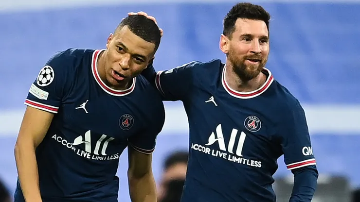 Kylian Mbappe of Paris Saint-Germain celebrates with Lionel Messi.