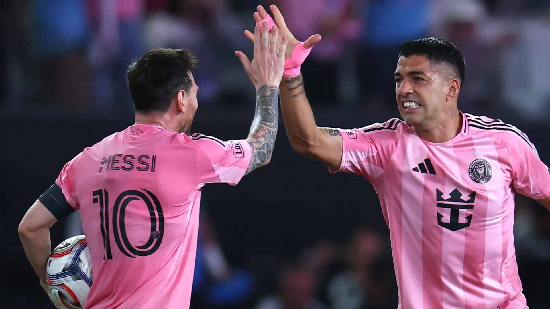 Luis Suárez #9 of Inter Miami CF celebrates with teammate Lionel Messi #10