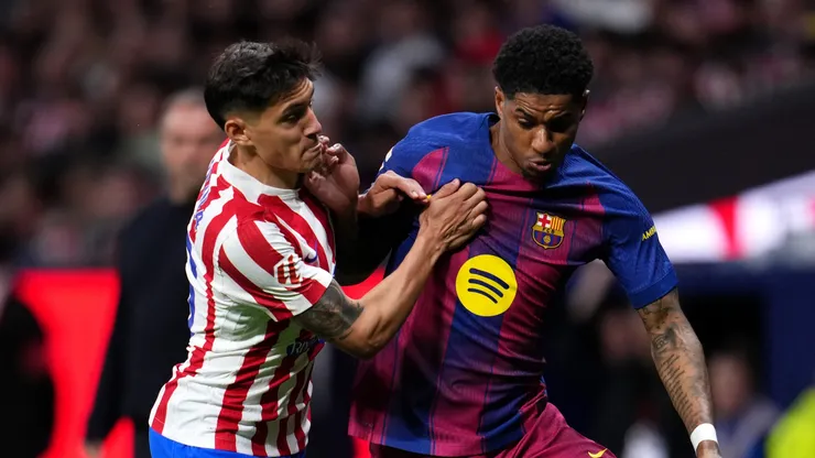 Marcus Rashford of Barcelona is challenged by Nahuel Molina of Atletico Madrid