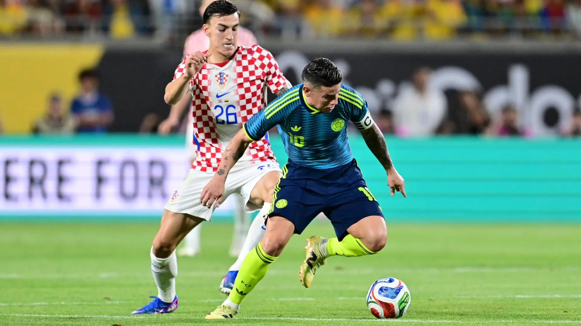 James Rodriguez of Colombia is challenged by Petar Musa of Croatia.