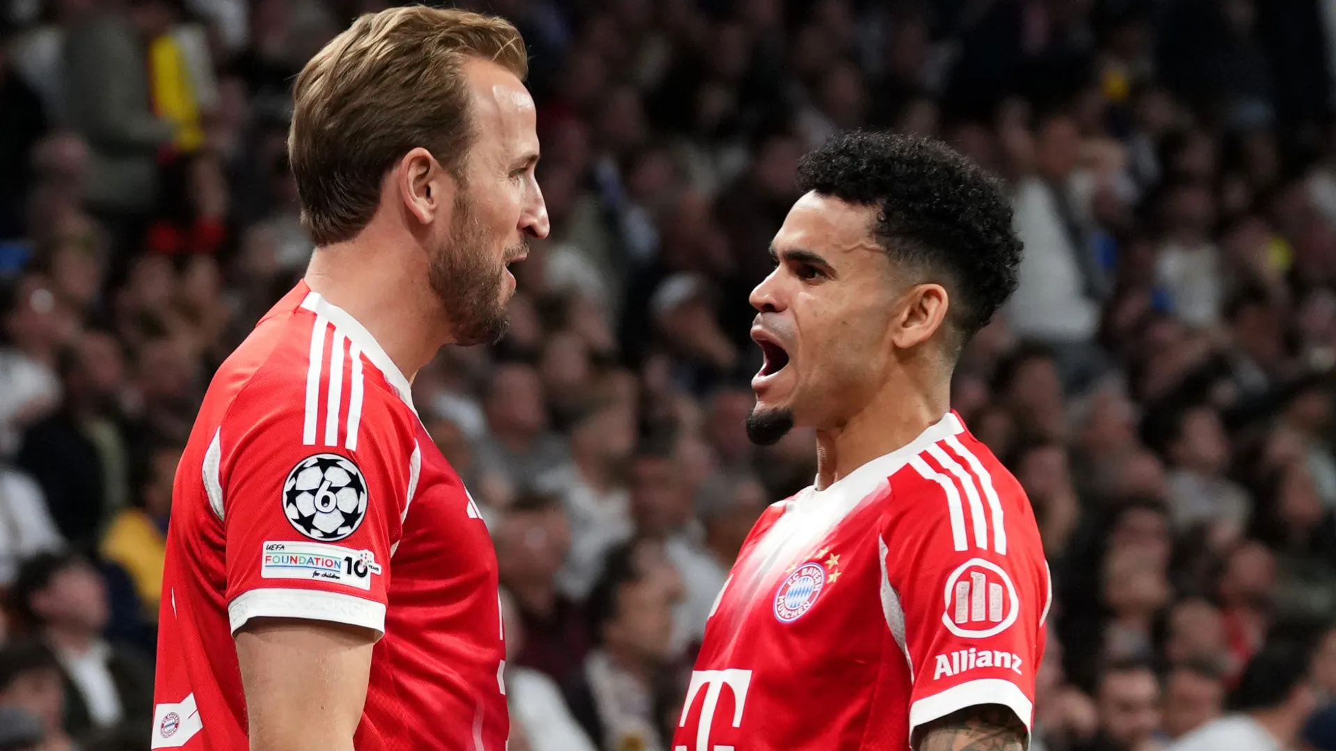 Harry Kane of FC Bayern Munich celebrates scoring his team’s second goal with teammate Luis Diaz.