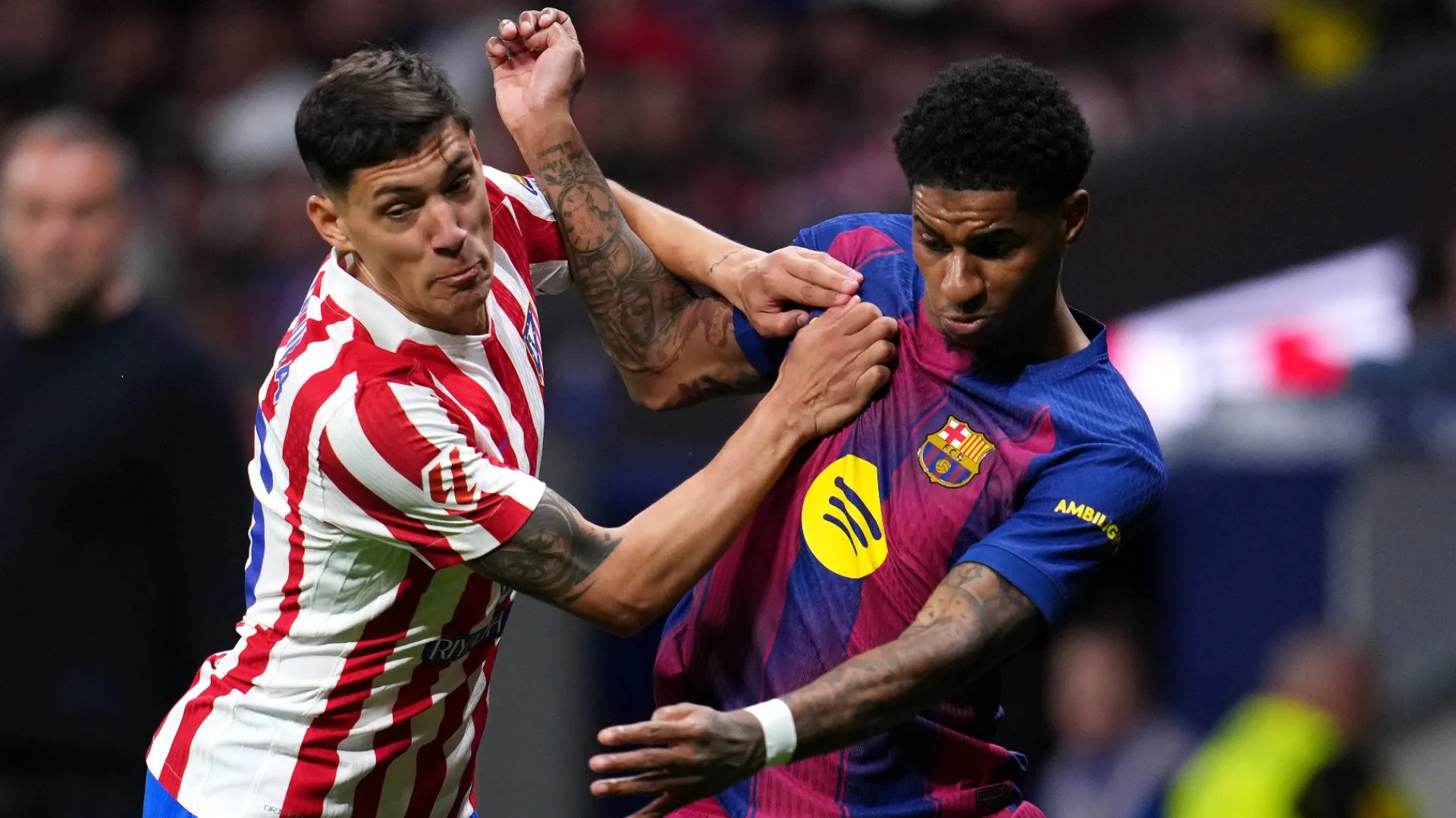 Marcus Rashford of FC Barcelona is challenged by Nahuel Molina of Atletico de Madrid.
