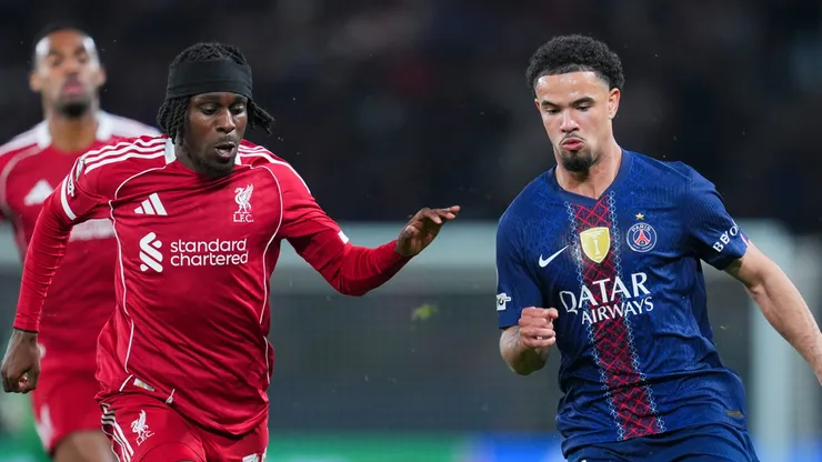 Warren Zaire Emery of PSG runs with the ball under pressure from Jeremie Frimpong of Liverpool