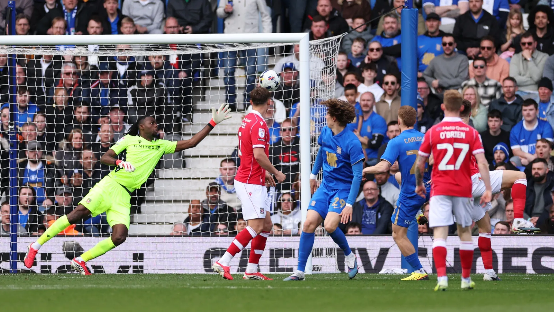 Carlos Vicente of Birmingham City scores his team's first goal past goalkeeper Arthur Okonkwo of Wrexham.