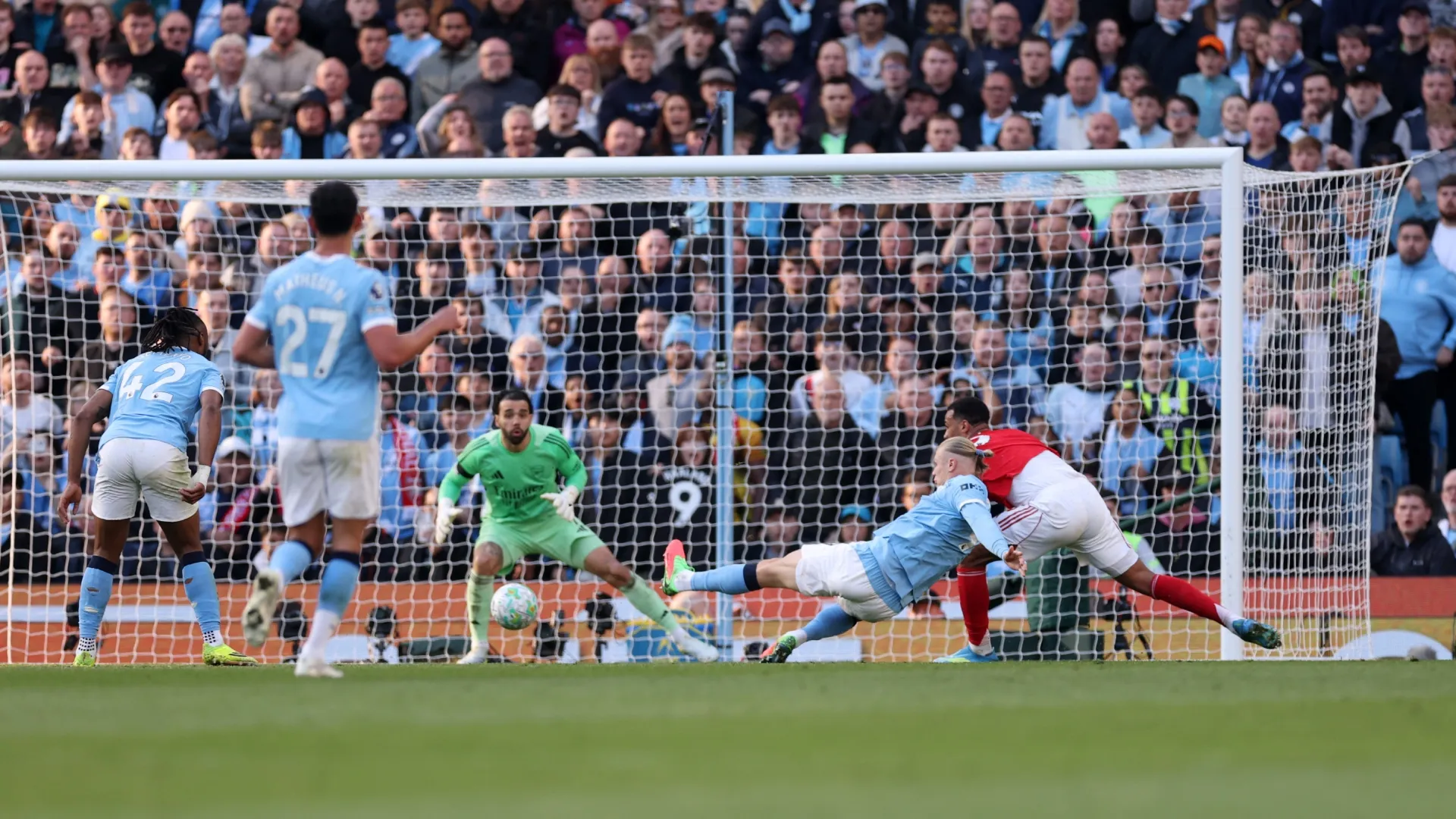 Erling Haaland of Manchester City scores his team's second goal against Arsenal.