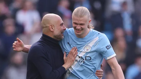 Pep Guardiola, Manager of Manchester City, and Erling Haaland celebrating.