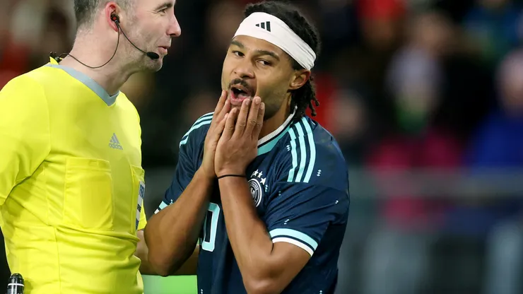 erge Gnabry of Germany reacts whilst interacting with Referee Chris Kavanagh