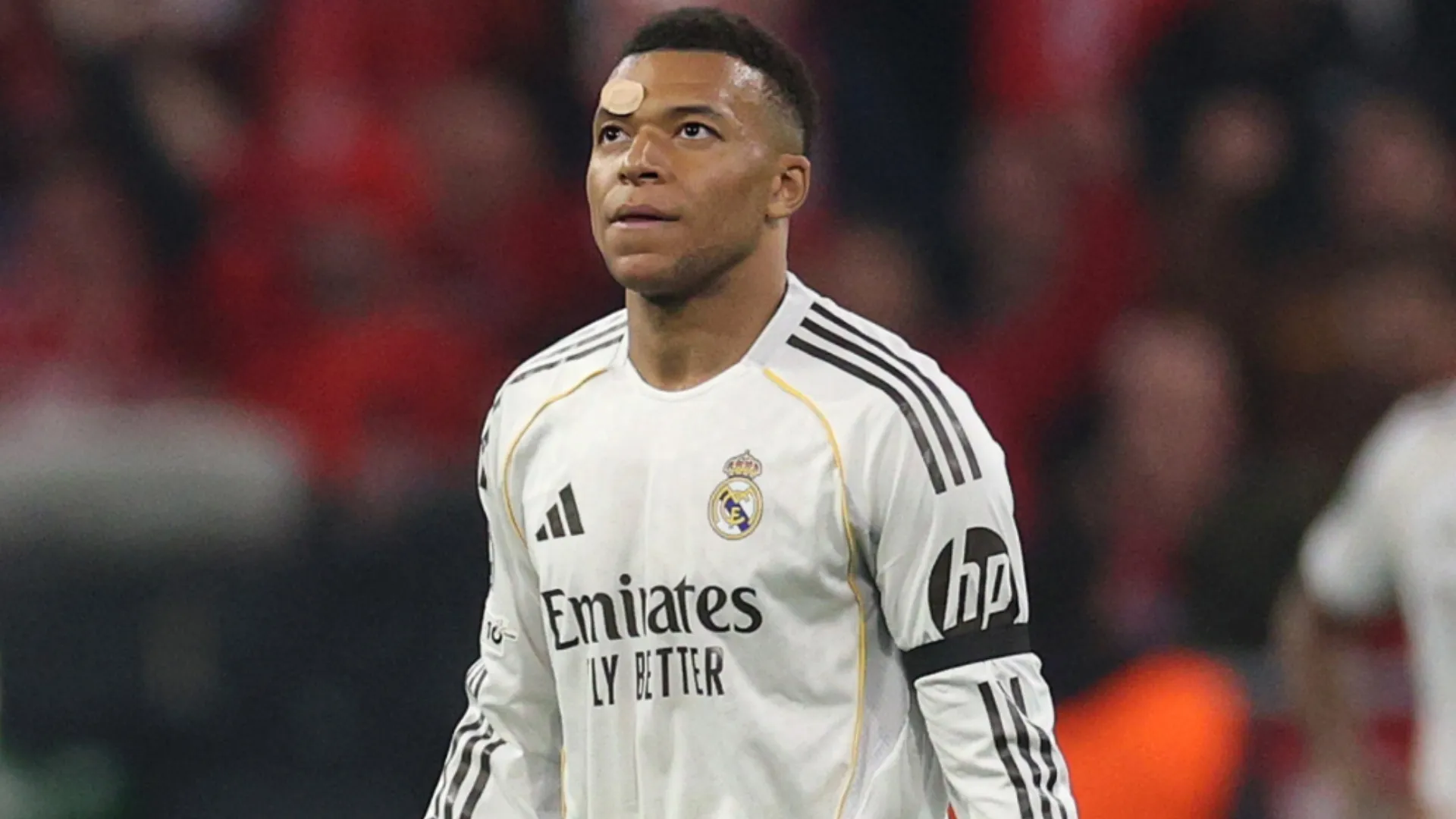 Kylian Mbappe of Real Madrid looks dejected after Harry Kane of FC Bayern Munich.