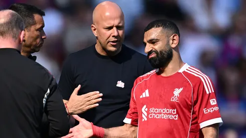 Mohamed Salah of Liverpool reacts with Arne Slot, Manager of Liverpool, after being substituted off