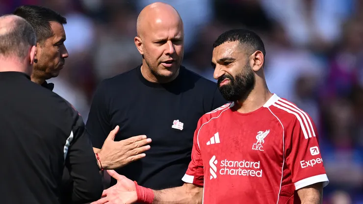 Mohamed Salah of Liverpool reacts with Arne Slot, Manager of Liverpool, after being substituted off