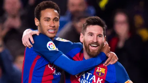 Lionel Messi (R) of FC Barcelona celebrates with his teammate Neymar Santos Jr (L).