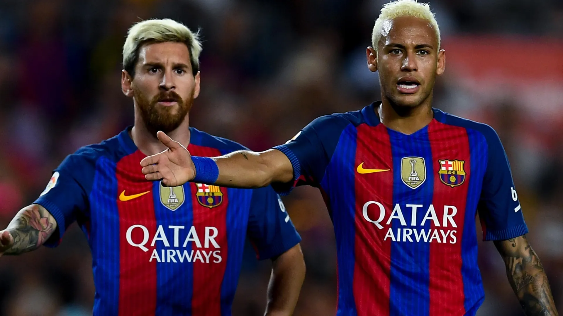 Lionel Messi (L) and Neymar Jr. of FC Barcelona