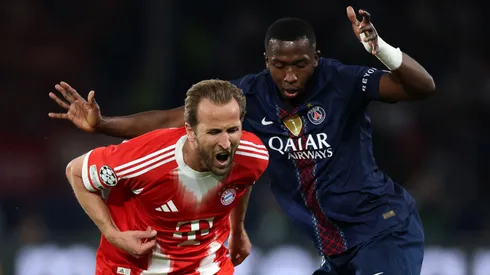 Harry Kane of FC Bayern Munich is challenged by William Pacho of Paris Saint-Germain.