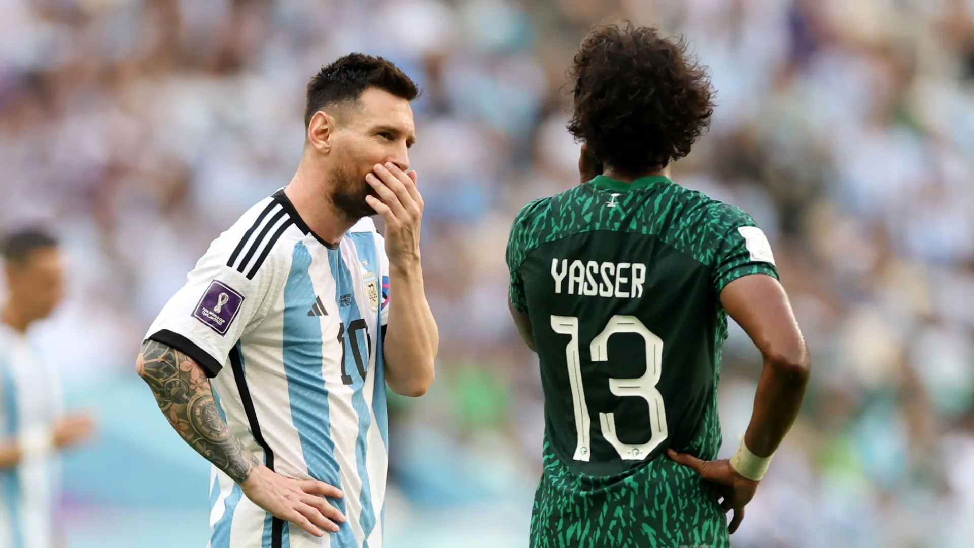 Lionel Messi of Argentina speaks with Yasser Al-Shahrani of Saudi Arabia during the FIFA World Cup Qatar 2022.