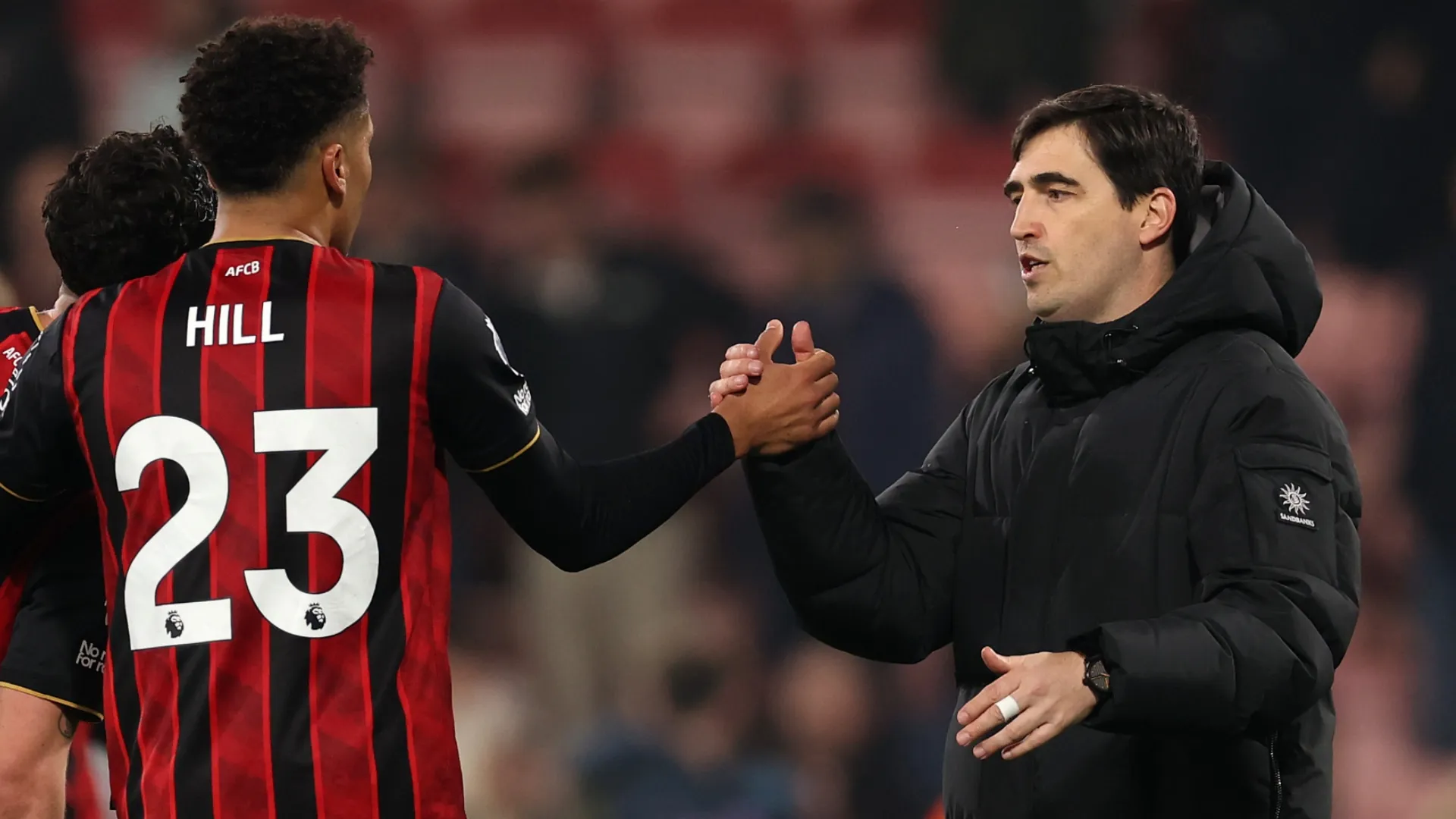 Andoni Iraola, Manager of AFC Bournemouth, shakes hands with James Hill.