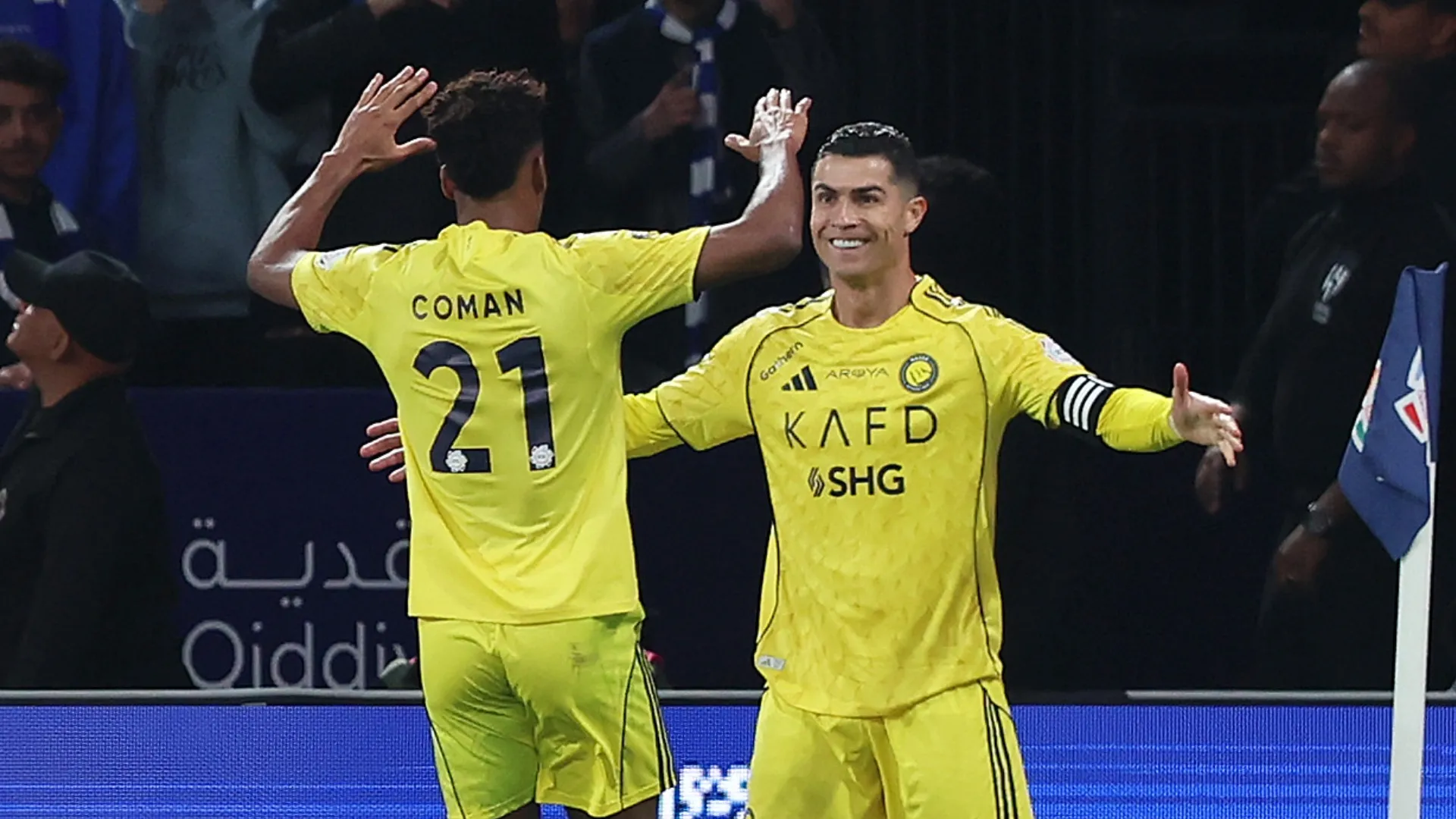 Cristiano Ronaldo of Al-Nassr celebrates with teammate Kingsley Coman.