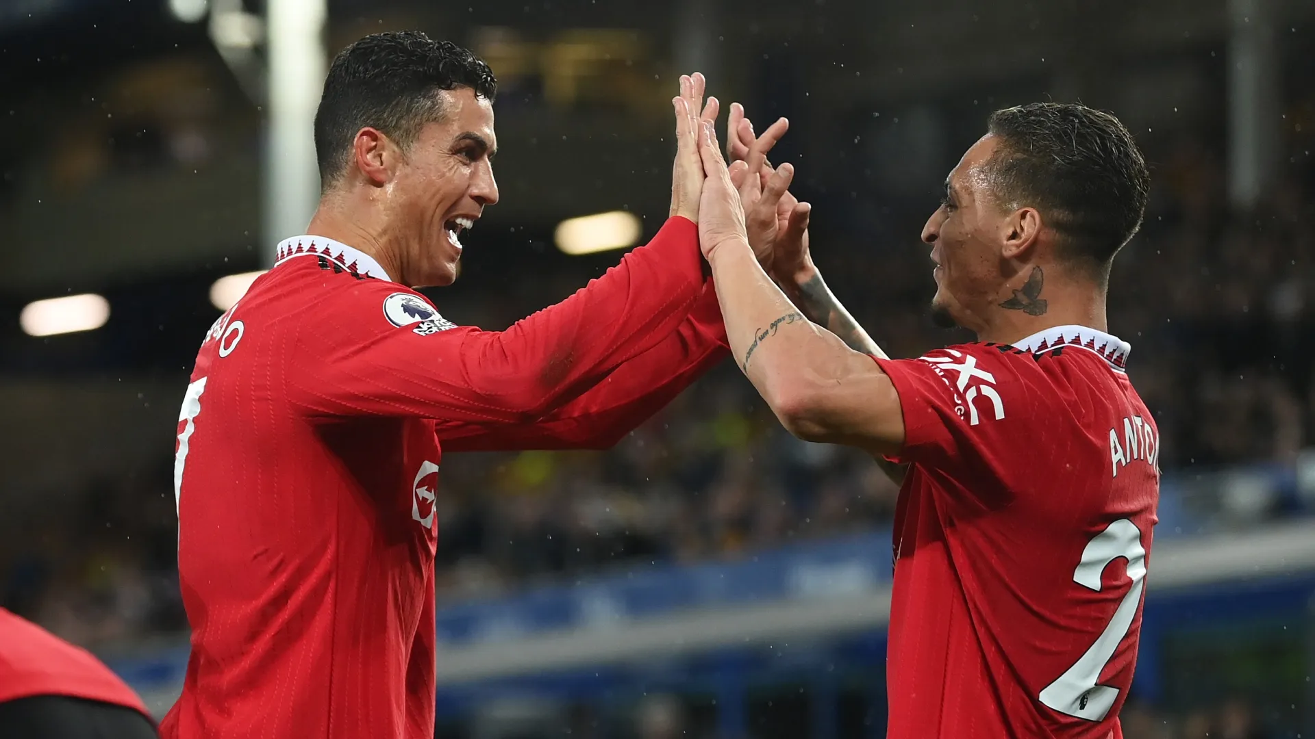 Cristiano Ronaldo celebrates with Antony of Manchester United.