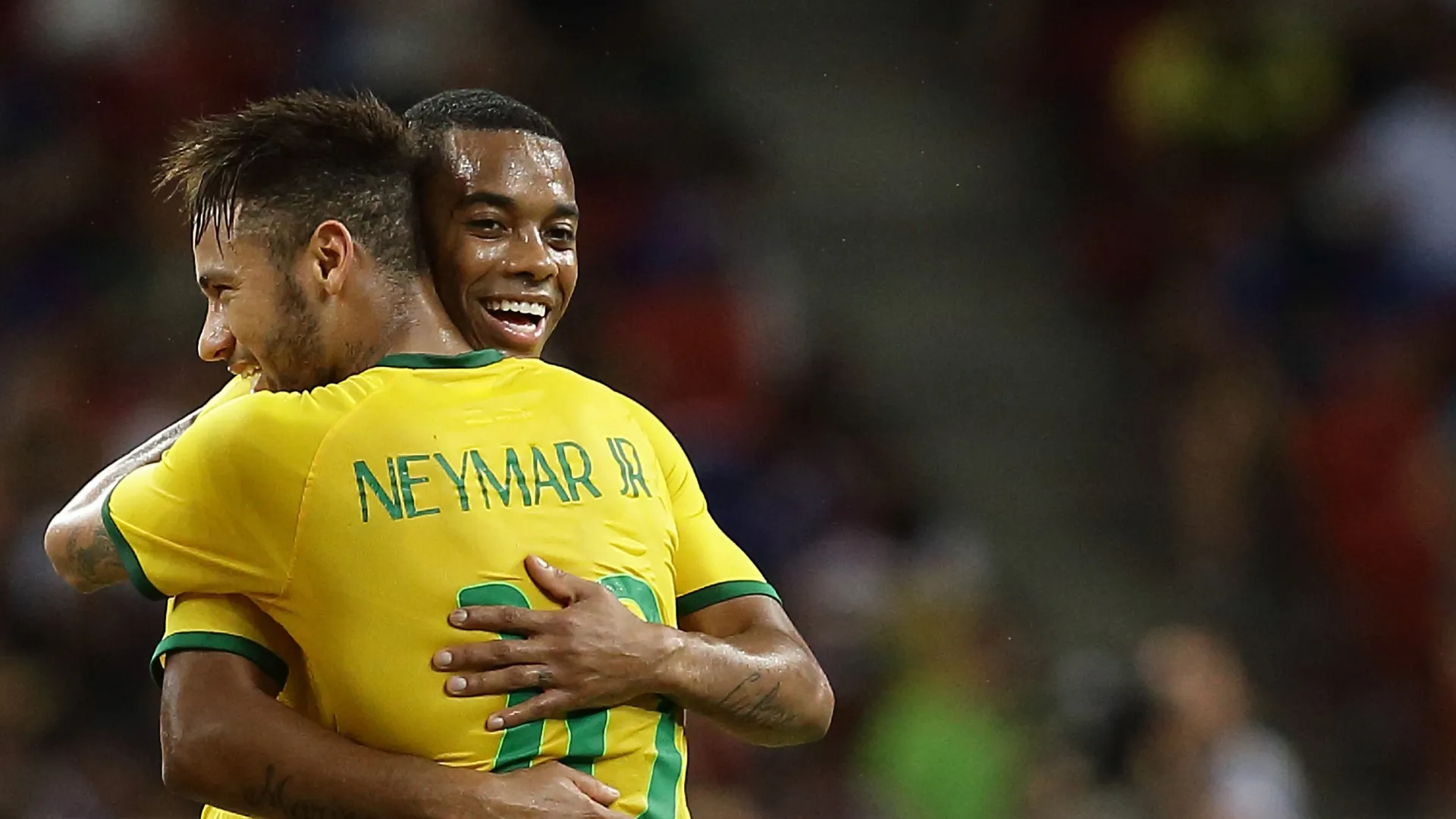 Neymar and Robinho of Brazil embracing.