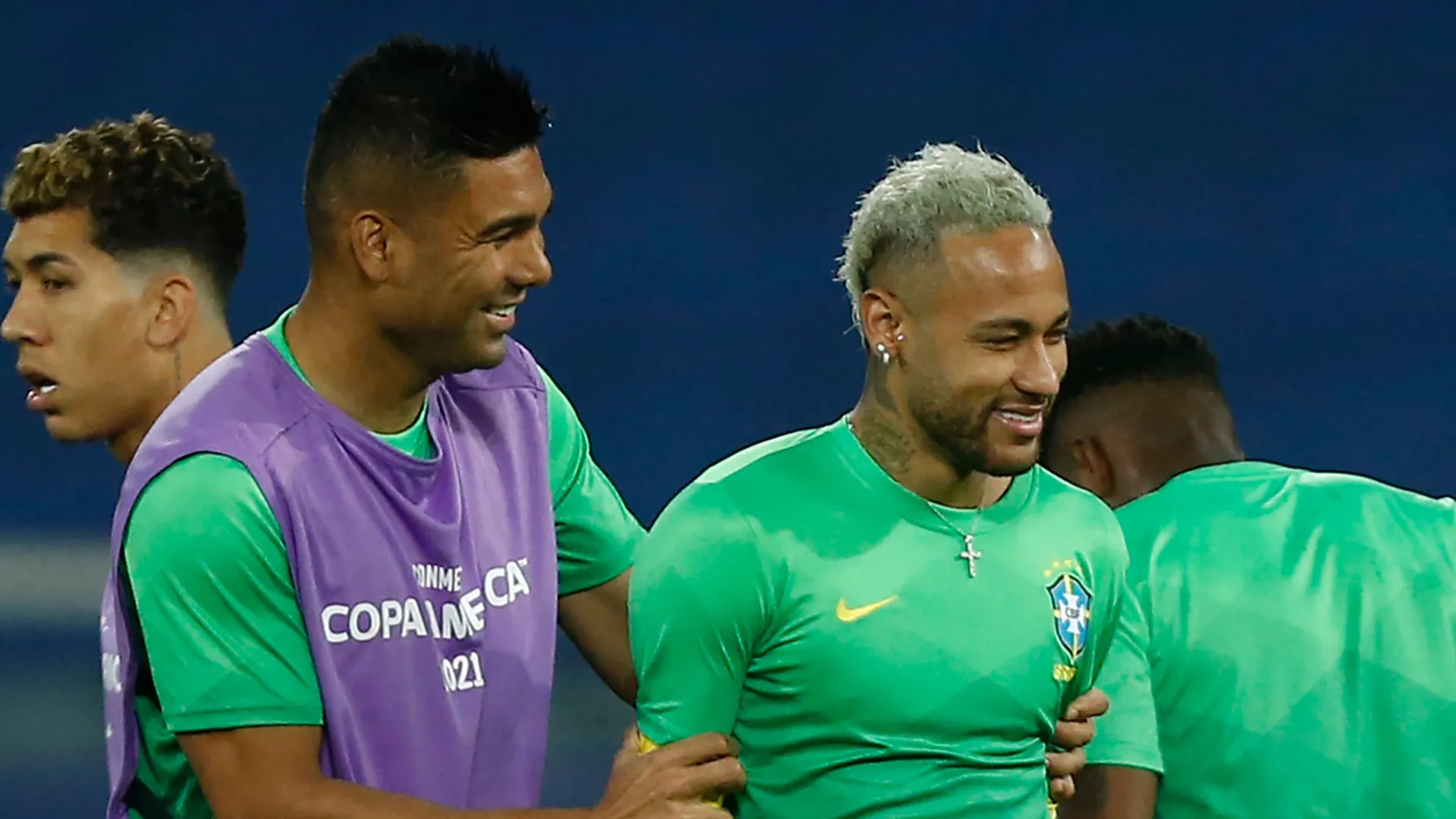 (L-R) Casemiro of Brazil jokes with teammate Neymar Jr.