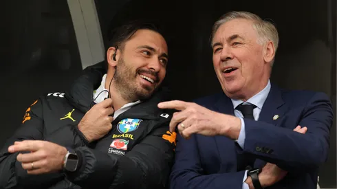Carlo Ancelotti, Head Coach of Brazil, chats with his assistant coach Davide Ancelotti.