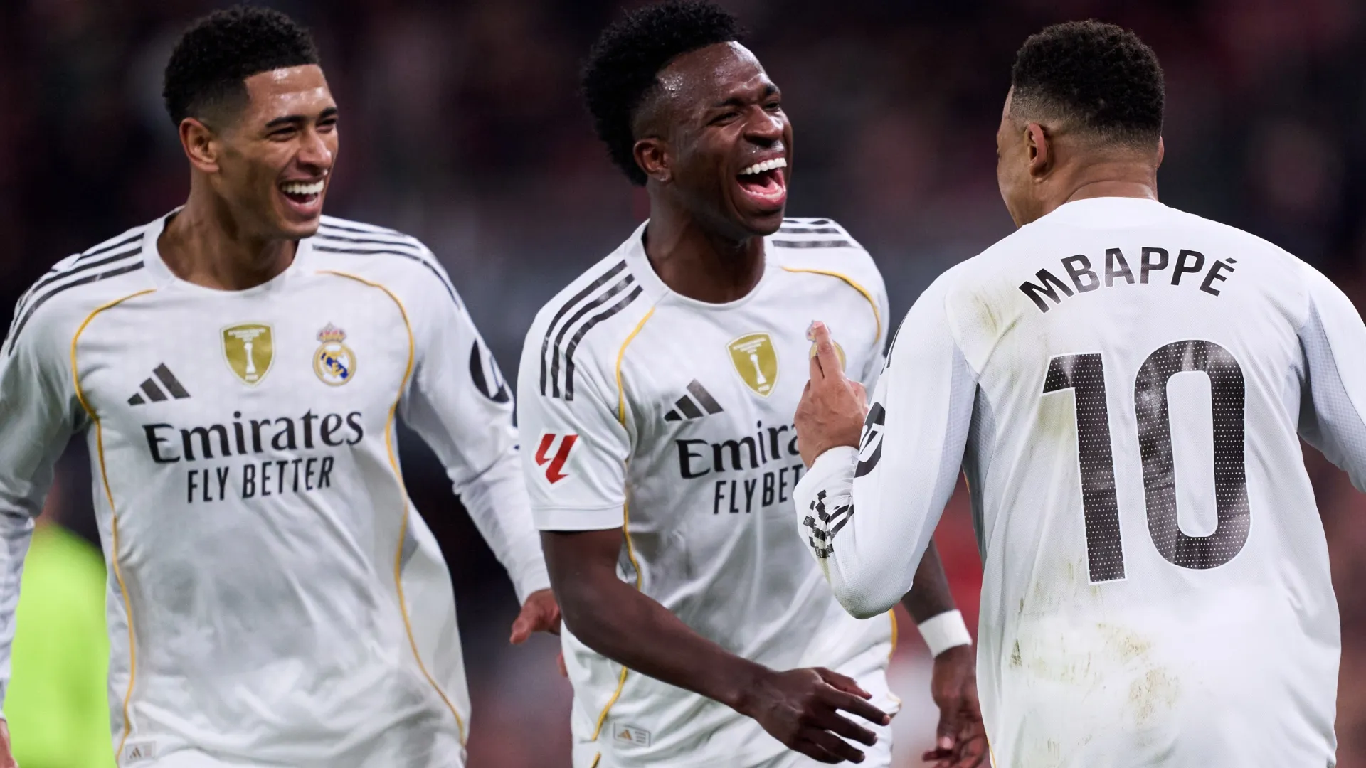 Kylian Mbappe of Real Madrid celebrates a goal  with Vinicius Junior and Jude Bellingham. 