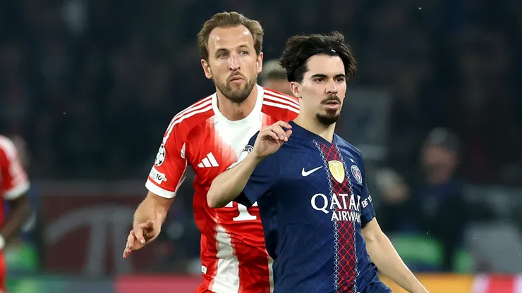 Vitinha of Paris Saint-Germain is challenged by Harry Kane of FC Bayern Munich